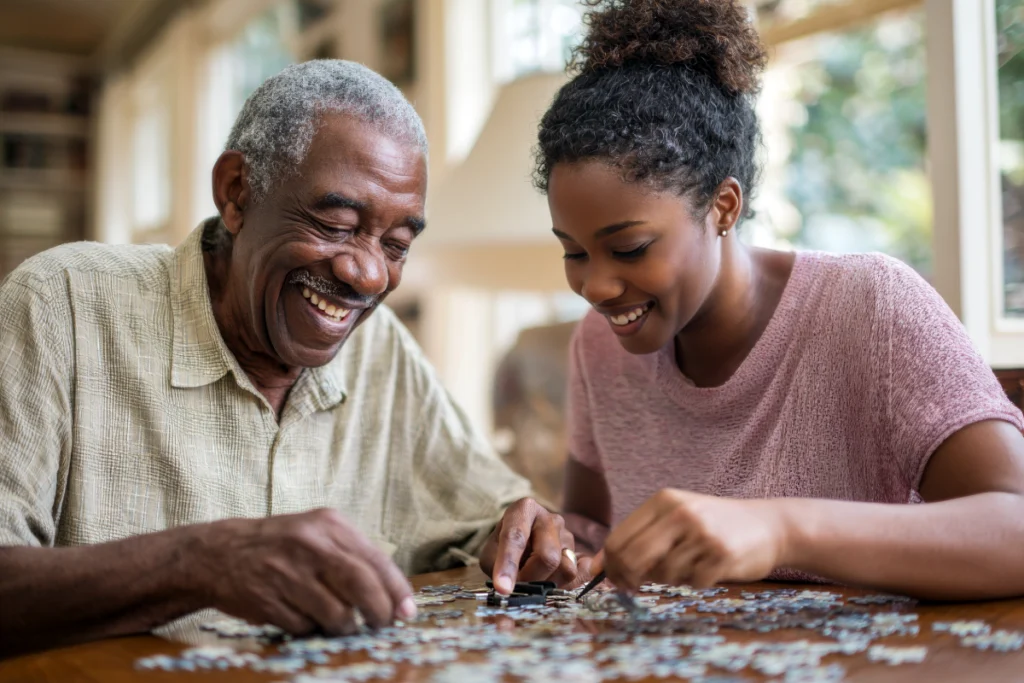 A resident and a relative working through a puzzle together