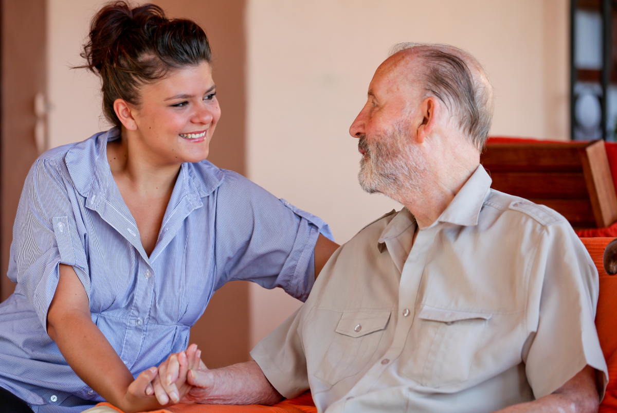 A team member helping a resident