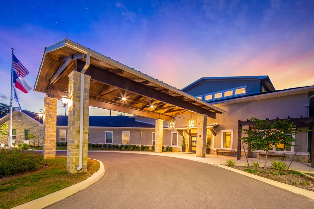 The covered entrance at VIVERE Life Stone Oak on Wilderness Oak